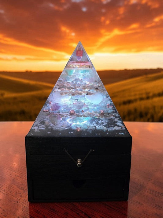 SoulStone Designs Prism of Clarity orgonite lamp with crystals and LED light on a black wooden jewellery box base.