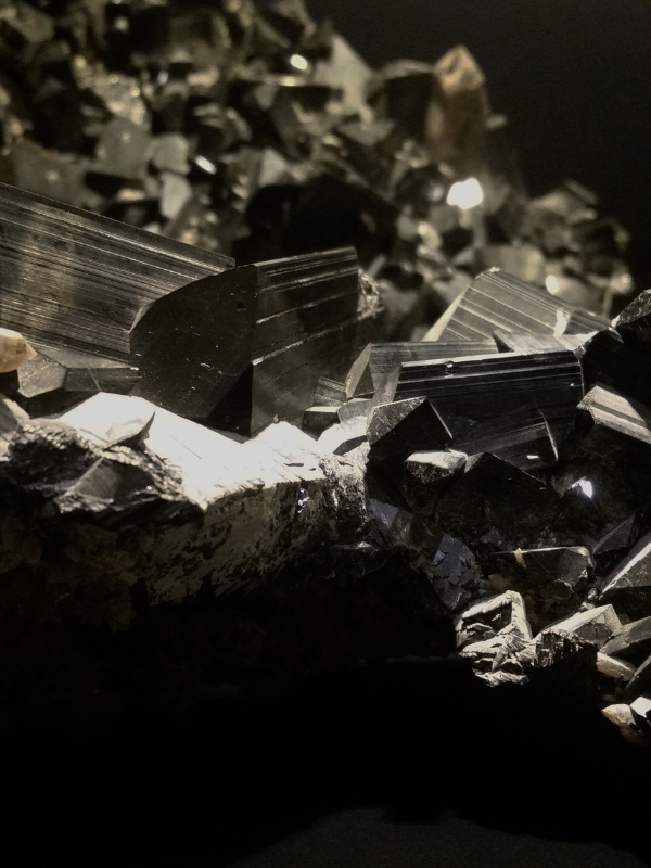 Black tourmaline and smoky quartz crystals used for grounding and protection