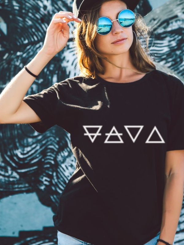 Woman wearing black SoulStone Designs t-shirt featuring sacred geometry symbols.