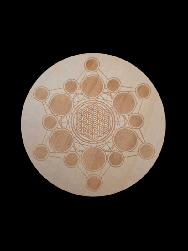 Wooden gridding plate with geometric design on a black background
