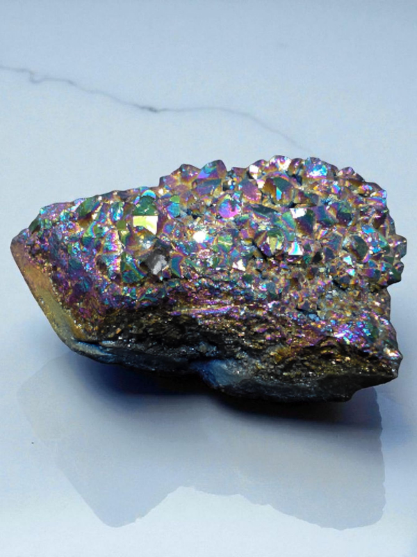A radiant Titanium Aura Quartz cluster