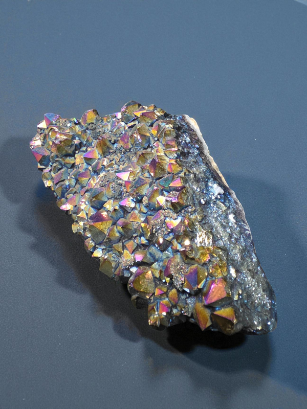 A radiant Titanium Aura Quartz cluster