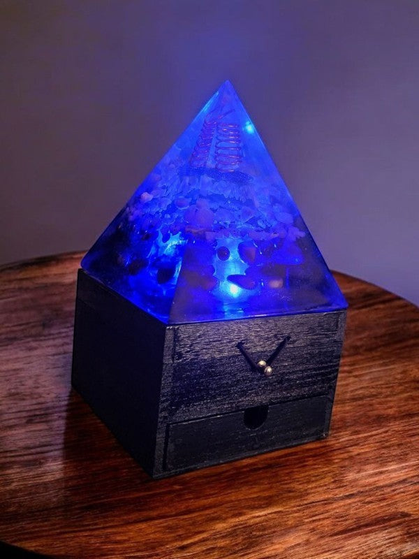 Soul Stone Designs Celestial Flow Orgonite Lamp with blue light, clear quartz, copper coil, and crystals on wooden box.