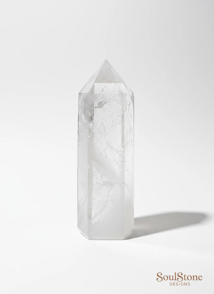 SoulStone Designs clear quartz tower, polished with natural inclusions for clarity and energy balance. Ideal for meditation and manifestation.