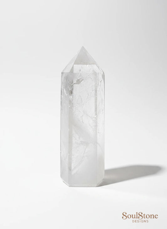 SoulStone Designs clear quartz tower, polished with natural inclusions for clarity and energy balance. Ideal for meditation and manifestation.