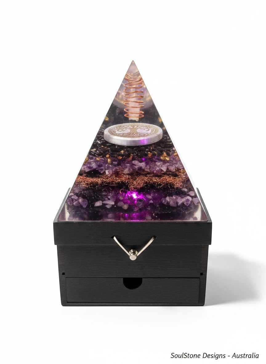 SoulStone Designs pyramid orgonite lamp with amethyst, shungite, Tree of Life, and copper coil, lit from within.