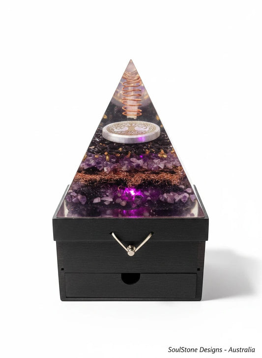 SoulStone Designs pyramid orgonite lamp with amethyst, shungite, Tree of Life, and copper coil, lit from within.