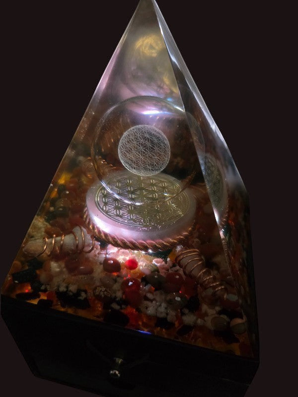 Soul Stone Designs orgonite pyramid lamp with Flower of Life, selenite, quartz, carnelian, sunstone, and black tourmaline.