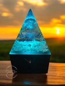SoulStone Designs orgonite pyramid lamp with Metatron's Cube glass sphere, Flower of Life copper disc, and six crystal points on a wooden base with LED light.