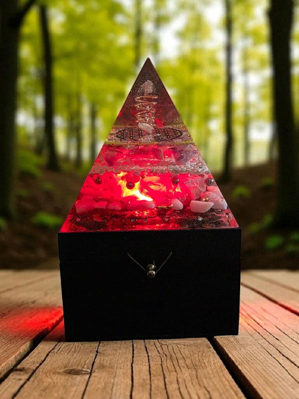 SoulStone Designs Celestial Clarity orgonite pyramid lamp with red glow, clear quartz, lepidolite, fluorite, howlite, blue calcite, and copper flower of life.
