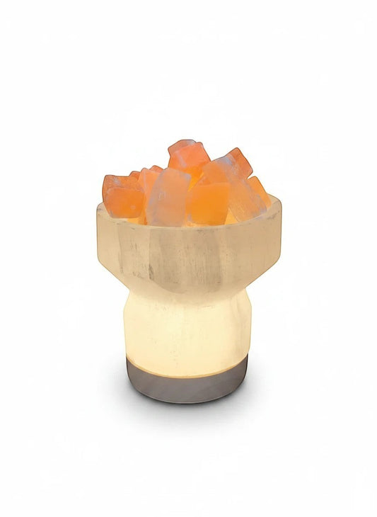 Soul Stone Designs Selenite bowl lamp with peach selenite chunks, emitting a warm golden glow. Natural crystal lamp.