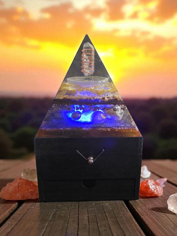 SoulStone Designs Solar Heart Orgonite Lamp with Clear Quartz, Citrine, Sunstone, Rose Quartz, and Honey Calcite on a wooden box base.