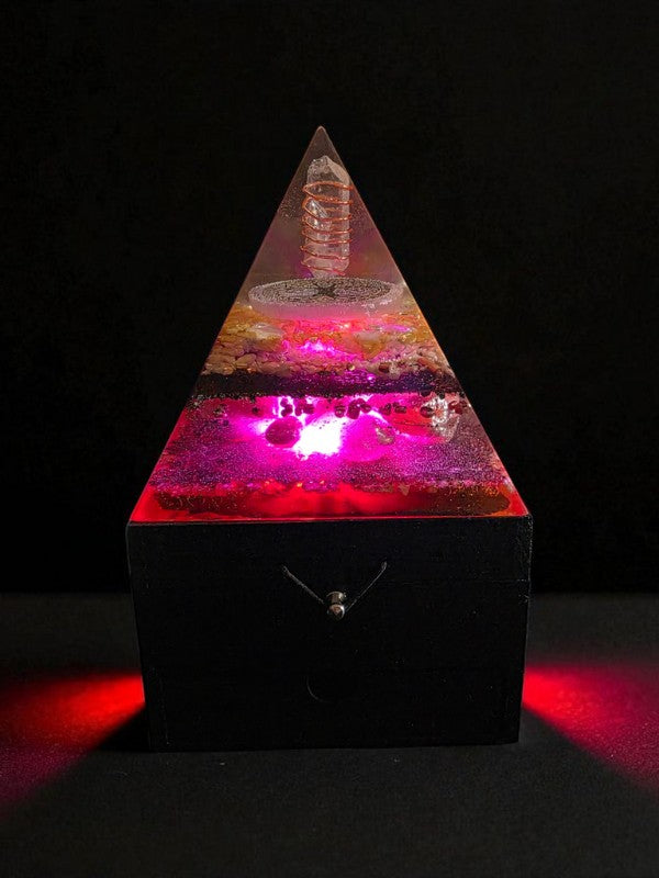 Soul Stone Designs Solar Heart Orgonite Lamp with Clear Quartz, Selenite, Citrine, Sunstone, Rose Quartz, and Honey Calcite. Pink and gold resin pyramid with LED light.