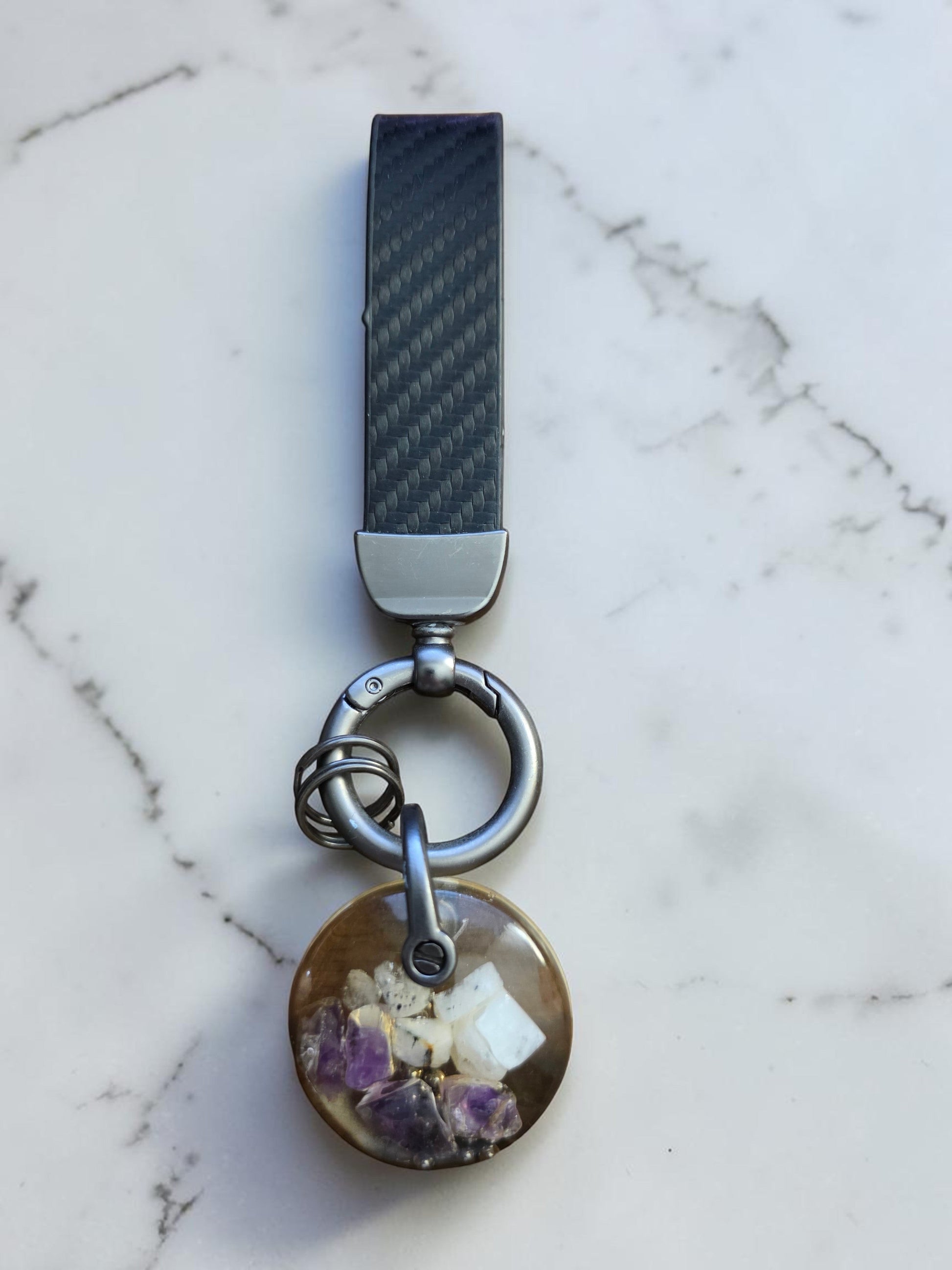 Soul Stone Designs keychain with a round orgonite pendant containing amethyst and moonstone crystals.