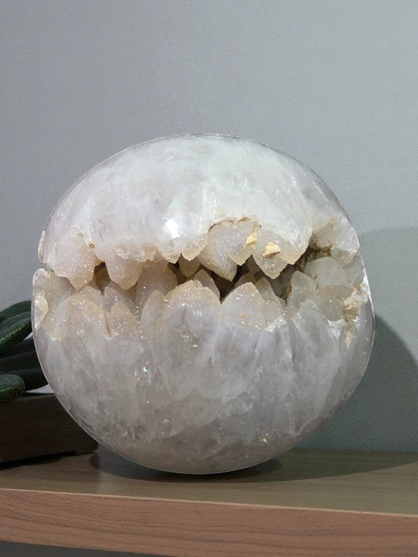 Soul Stone Designs clear quartz sphere with a natural sugar druzy cavity, polished exterior, and sparkling crystal formations inside.