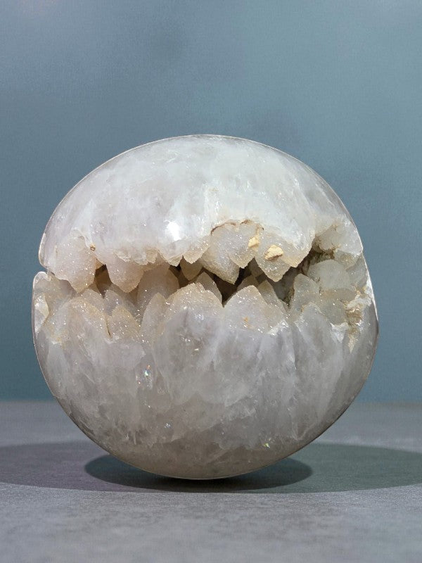 Soul Stone Designs clear quartz sphere with a natural sugar druzy cavity, polished exterior, and shimmering crystal interior.