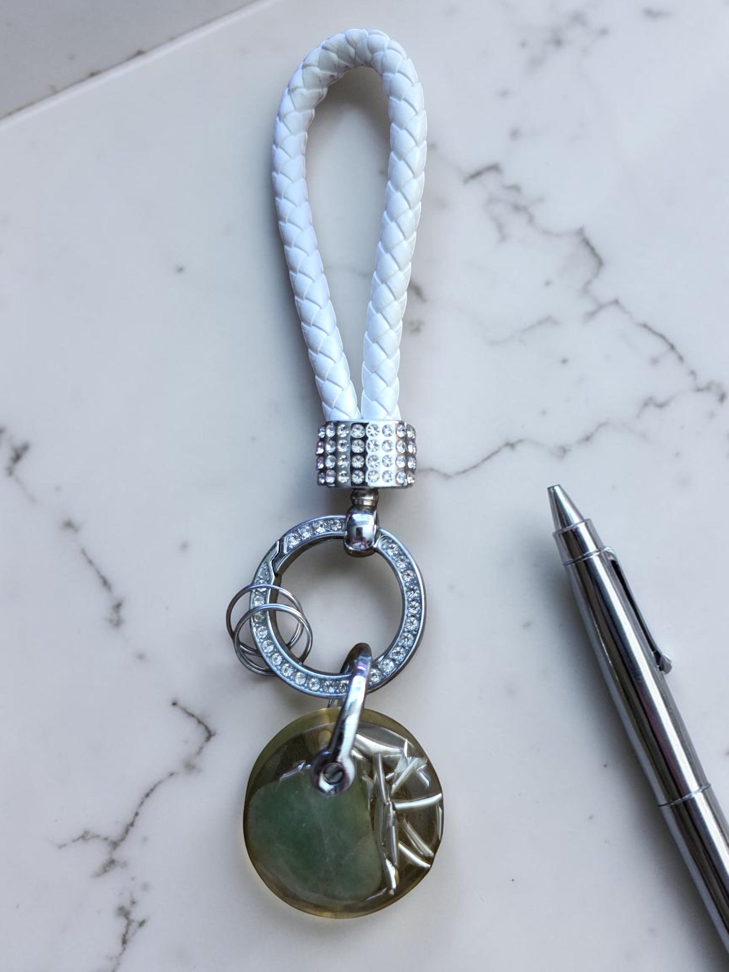 Soul Stone Designs green aventurine orgonite keychain with white braided strap and crystal embellishments.