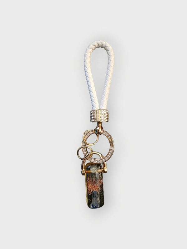 Soul Stone Designs Kyanite Crystal Orgonite Keychain with white braided strap and crystal-encrusted ring.