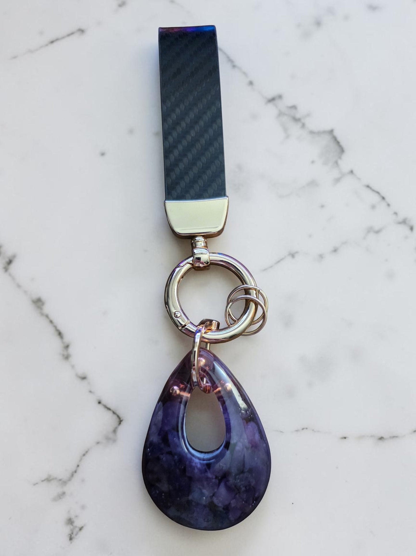 Soul Stone Designs Lepidolite mini orgonite keychain with a teardrop-shaped purple crystal pendant and carbon fiber strap.