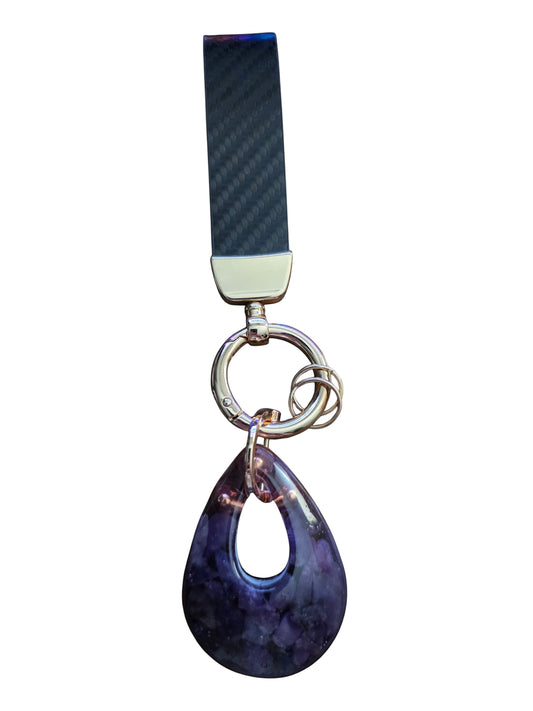 Soul Stone Designs Lepidolite orgonite keychain with a teardrop-shaped purple crystal pendant and carbon fiber strap.