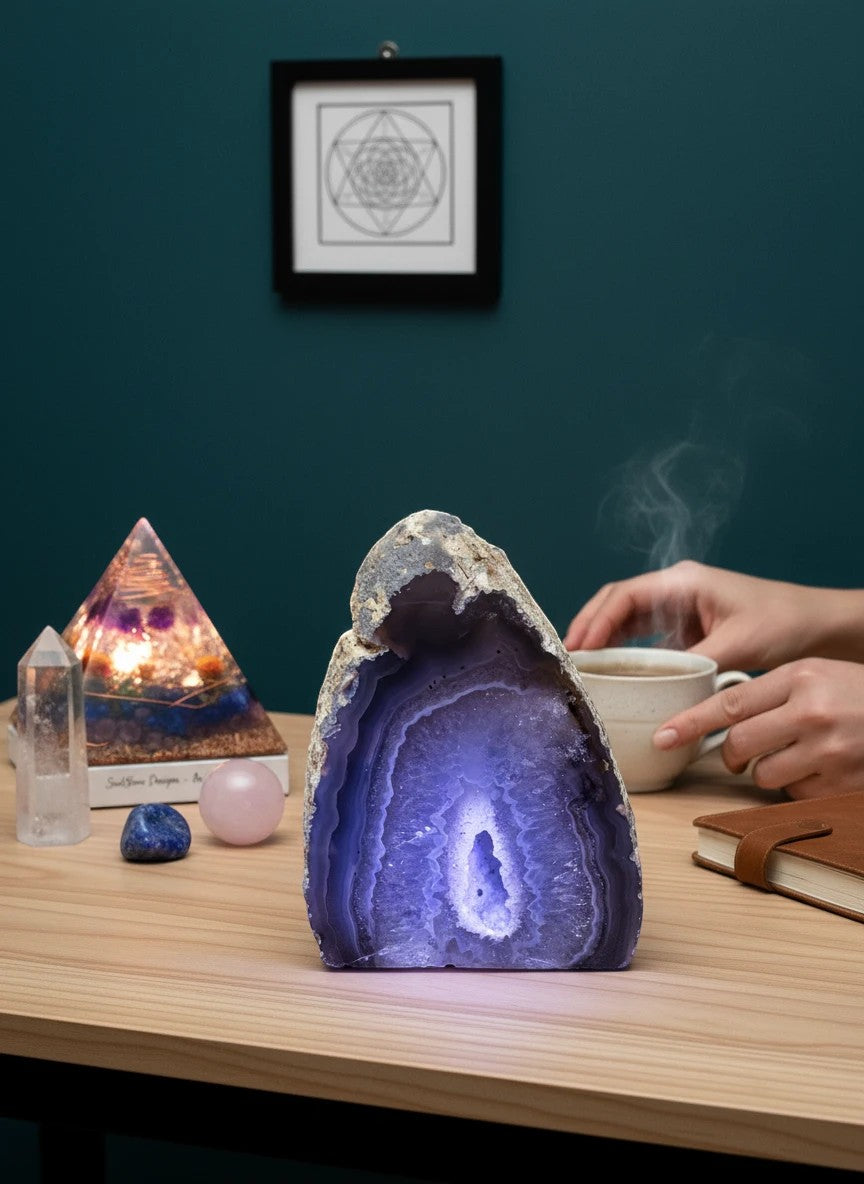 Soul Stone Designs natural druzy agate geode with purple light, banded agate exterior, and sparkling crystal interior.