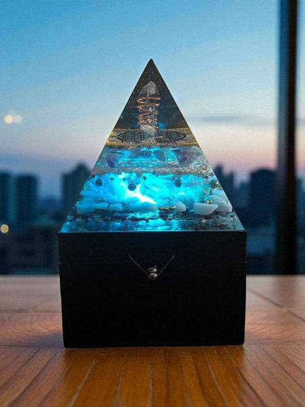 Soul Stone Designs Celestial Clarity orgonite pyramid lamp with blue light, clear quartz, lepidolite, fluorite, howlite, blue calcite, and copper.
